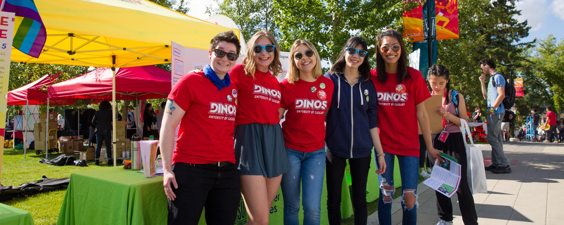Students pose for photo in Dinos red shirts