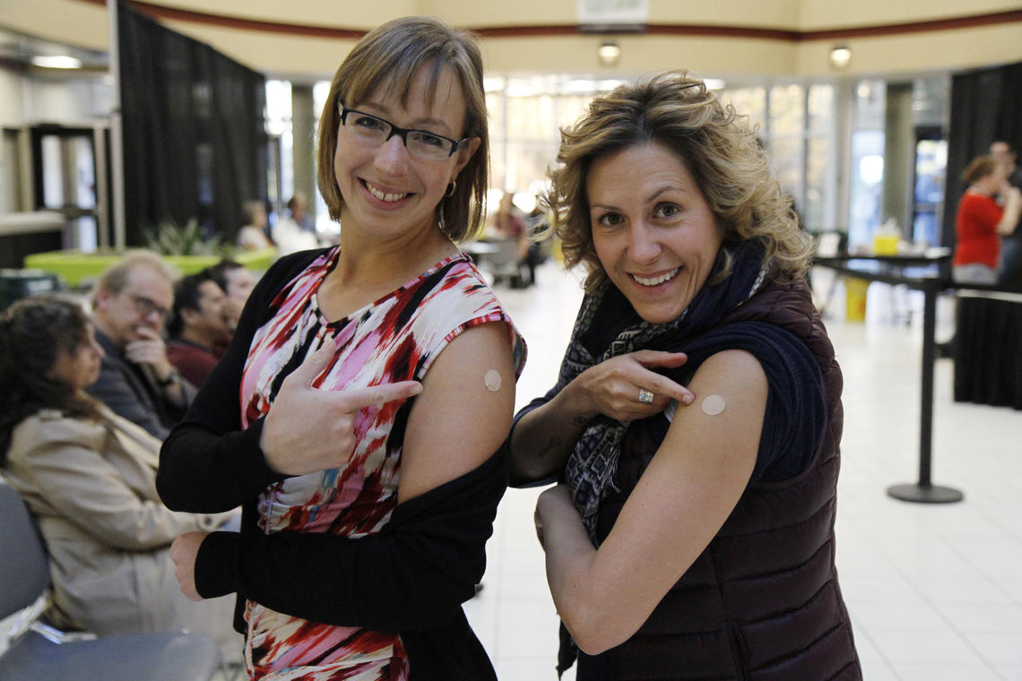 Jennifer Thannhauser, counsellor at the SU Wellness Centre, and Carla Bertsch, sexual violence support advocate, used the mandatory 15-minute waiting period to connect. Book your next meeting at the flu clinic!