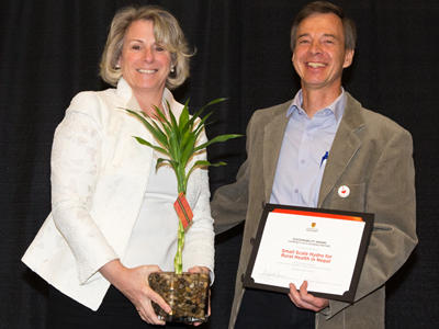 Ed Nowicki accepting the Sustainability Award for Community as a Learning Partner.