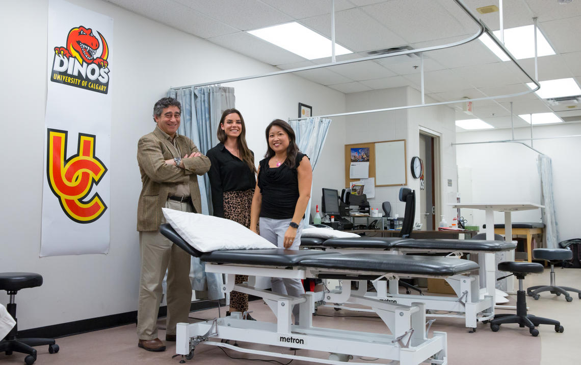 Nick Mohtadi, left, led a clinical trial with Dana Hunter, centre, research assistant, and Denise Chan, research co-ordinator, investigating anterior cruciate ligament (ACL) reconstruction for youth at high risk of knee reinjury. Photo by Riley Brandt, University of Calgary