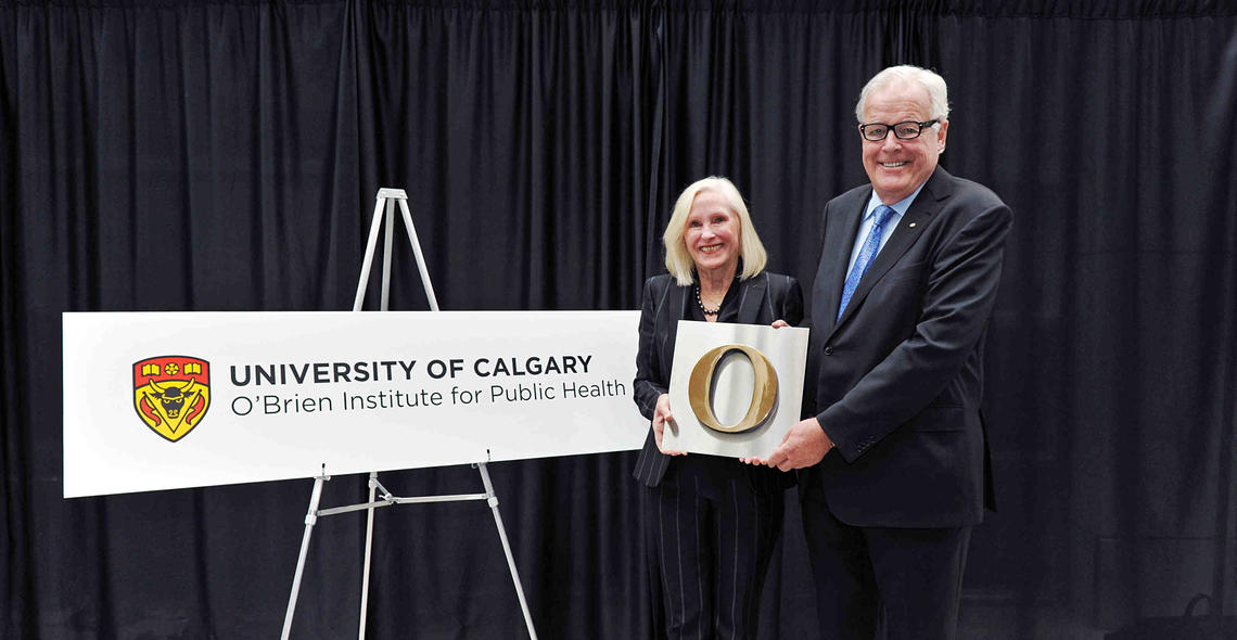 Gail and David O'Brien pose with their symbolic letter 'O' after their $12-million donation to the newly named O’Brien Institute for Public Health was announced on Tuesday at the University of Calgary.