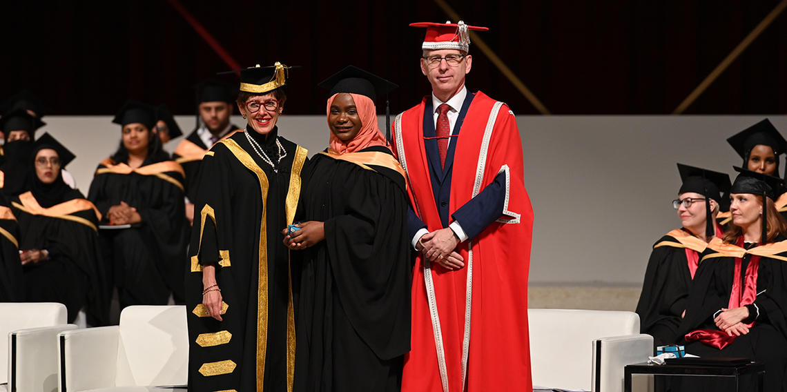 University of Calgary Chancellor Deborah Yedlin and President Ed McCauley flank graduating student Sharifat Makinde, recipient of the Gold Medal for academic achievement in the Bachelor of Nursing program.
