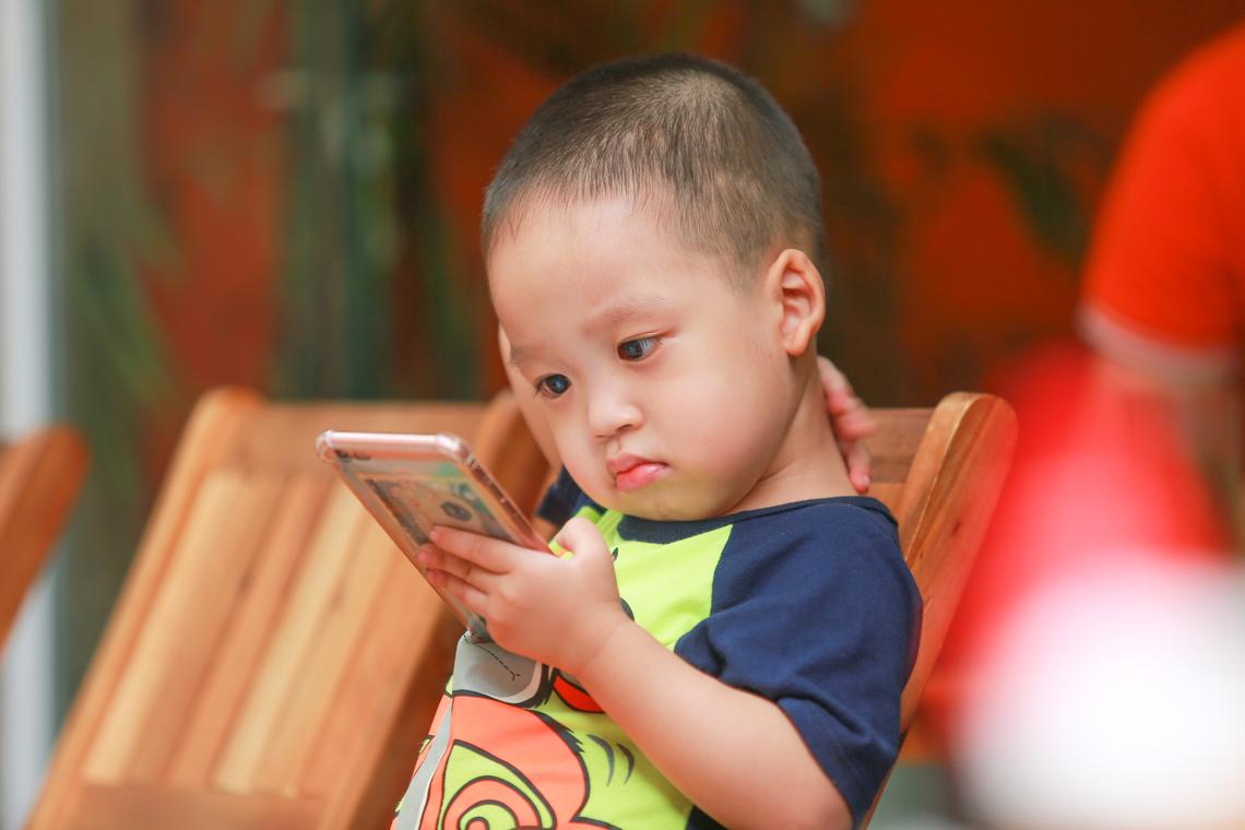 Little boy holding smartphone