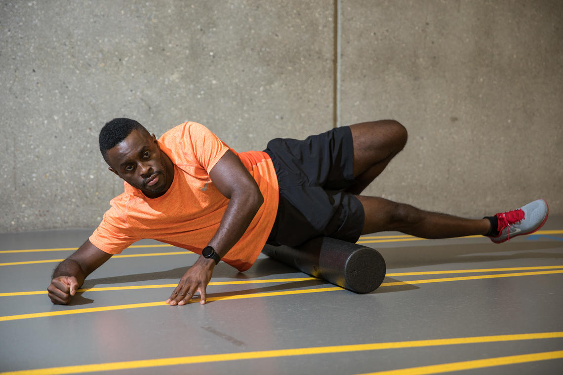 Sam Effah demonstrating foam rolling