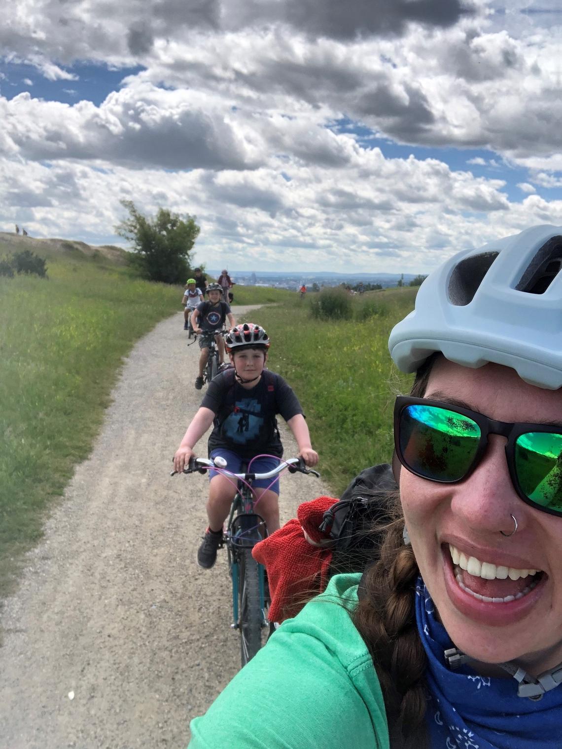 Group riding bikes in UCalgary summer camp