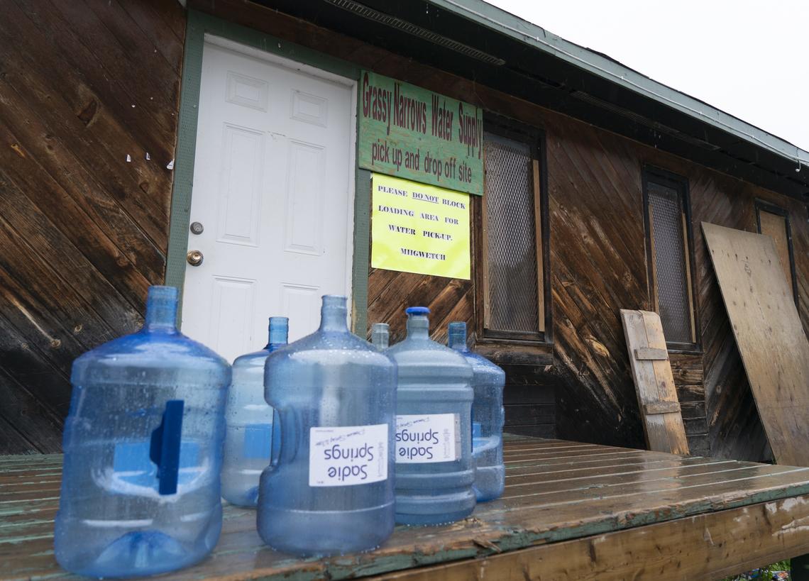 Water bottles sit on the porch of Grassy Narrows First Nation’s water supply.