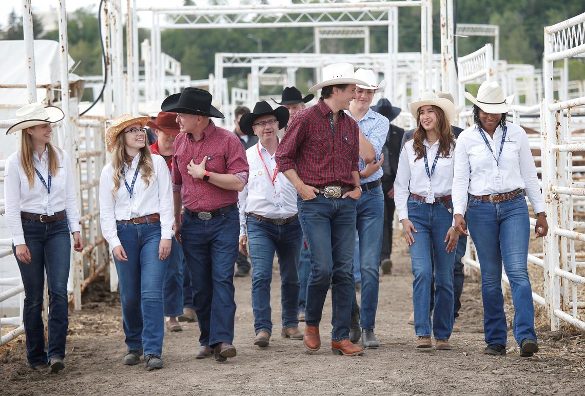 Prime Minister Justin Trudeau walks with UCVM research team at the Calgary Stampede. l