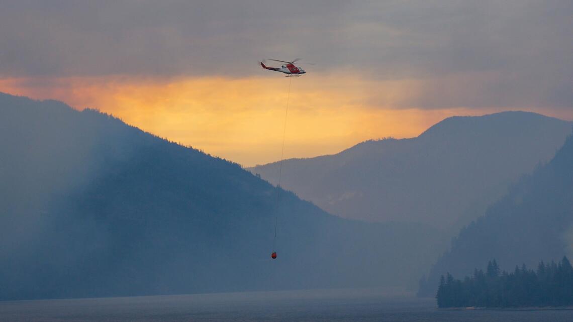 Firefighters work to contain blazes in the Kamloops and southeast areas of British Columbia this summer. 