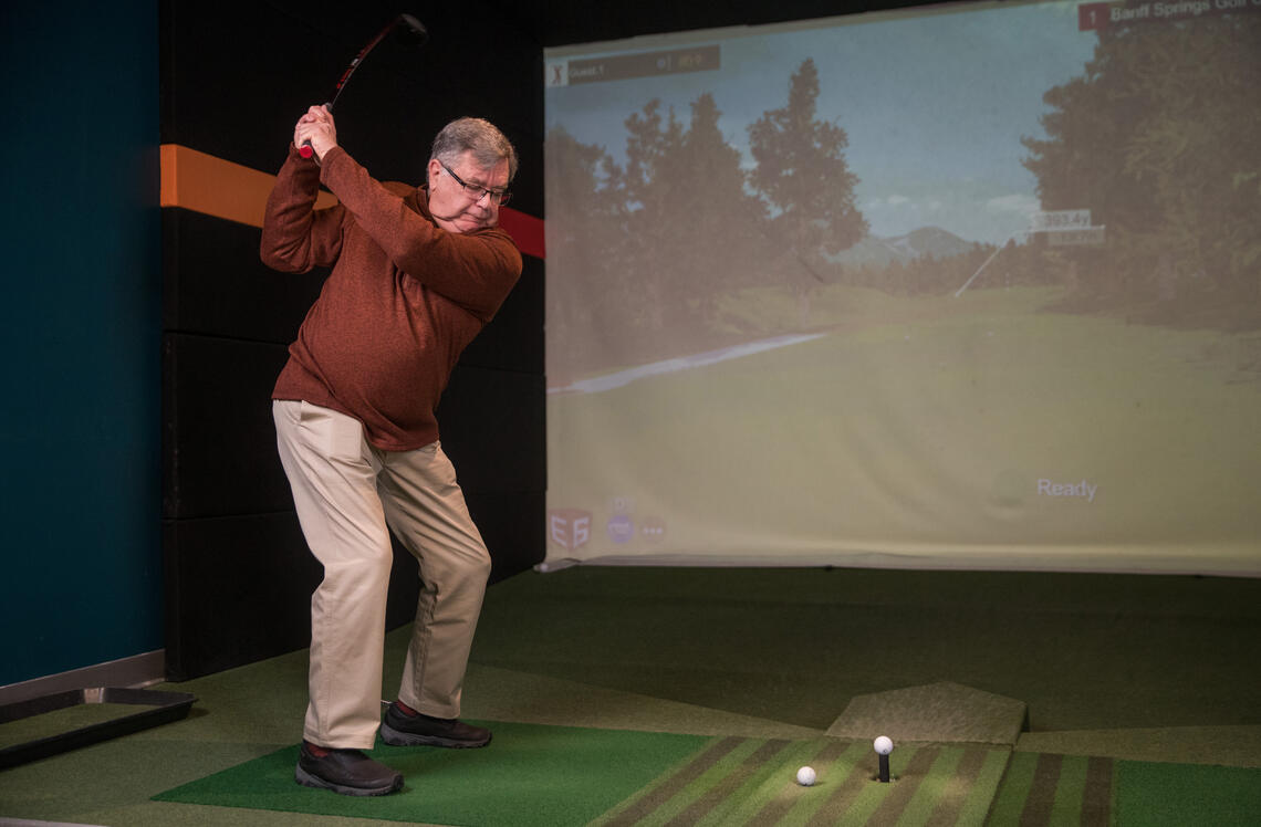 John Mac Donald swinging a golf club