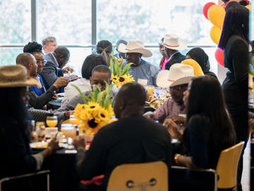 Graduate students, faculty and members of the Nigerian High Commission office enjoy a Stampede breakfast.
