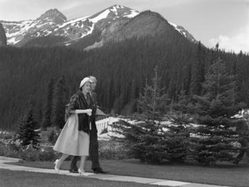 Queen Elizabeth II walking through grounds of Chateau Lake Louise with Chateau manager, D.A. Williams, Lake Louise, Alberta