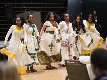 Six members from the Ethiopian and Eritrean Student Association perform a traditional East African dance showcasing cultural heritage and unity.