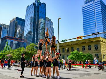 The UCalgary Cheer Squad performing at the Stampede Parade. 