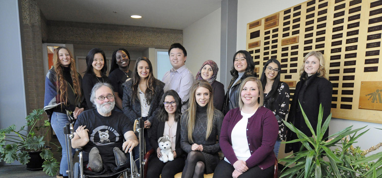 A research group from the Cumming School of Medicine known as the WolbPack encourages undergraduate students to pursue research opportunities. Current and alumni members include, back row, from left: Farwa Naqvi, Lucy Diep, Nicole Mfoafo-M’Carthy, Valentina Villamil, Wentao Li, Bushra Abdullah, Rochelle Deloria, Sadia Ahmed, Aspen Lilywhite. Front, from left: Gregor Wolbring, Manel Djebrouni, Aryn Lisitza and Kalie Mosig. Photos by Pauline Zulueta, Cumming School of Medicine