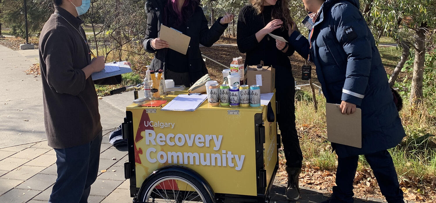 UCRC team members and volunteers with UCRC’s campus connection cart, handing out coffee and talking about campus recovery initiatives