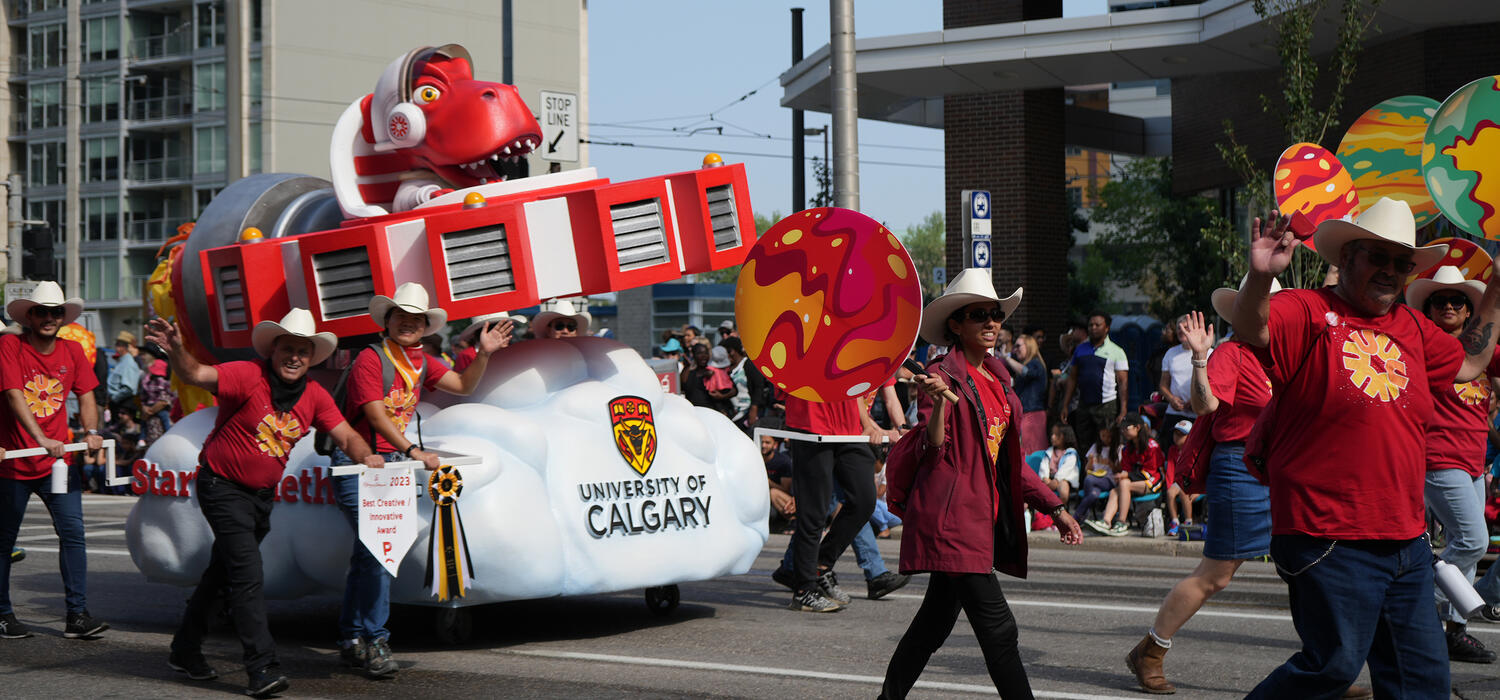 UCalgary's float being pushed through the Calgary Stampede Parade