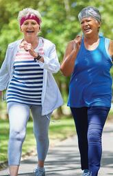 Older women walking together on a path in summer