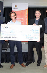 First-place team Neuraura was presented with the prize cheque at the 2018 TENET i2c competition finals on May 8. From left: Jon Meddings, dean of the Cumming School of Medicine; Pierre Wijdenes and Colin Dalton of Neuraura; and competition founder Ken Moore.