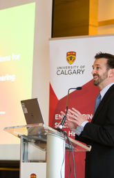 Michael Kallos, theme leader of the biomedical engineering research strategy, and a professor in the Schulich School of Engineering, helps announce the launch of the new strategy Monday at the Rozsa Centre. Photo by Riley Brandt, University o