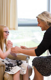 Susa Benseler, director of the Alberta Children's Hospital Research Institute, with a young patient. Photo by Riley Brandt, University of Calgary