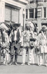 Guy Weadick and Indigenous participants in the Stampede parade, 1926.