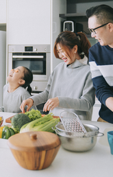 a family cooking together