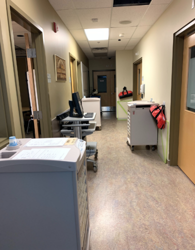 Med carts in hallway of Clinical Simulation Learning Centre at UCalgary Nursing.