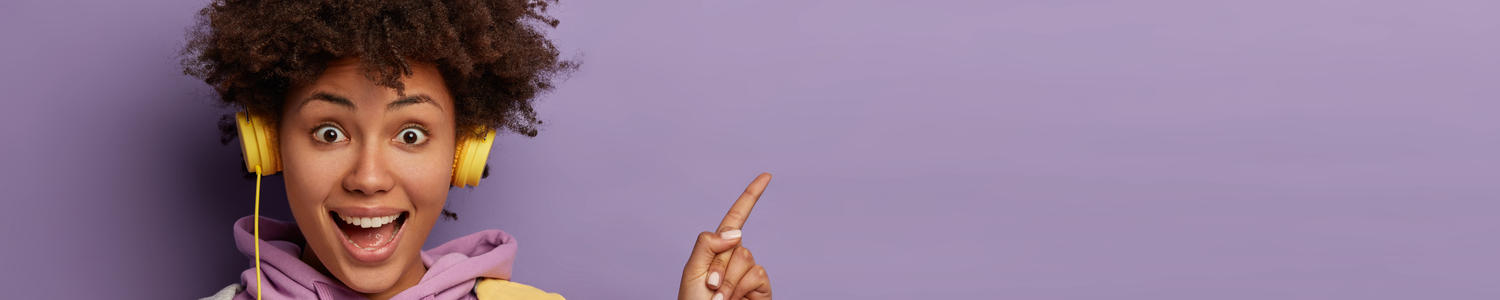 Young hipster woman listening to podcast on headphone