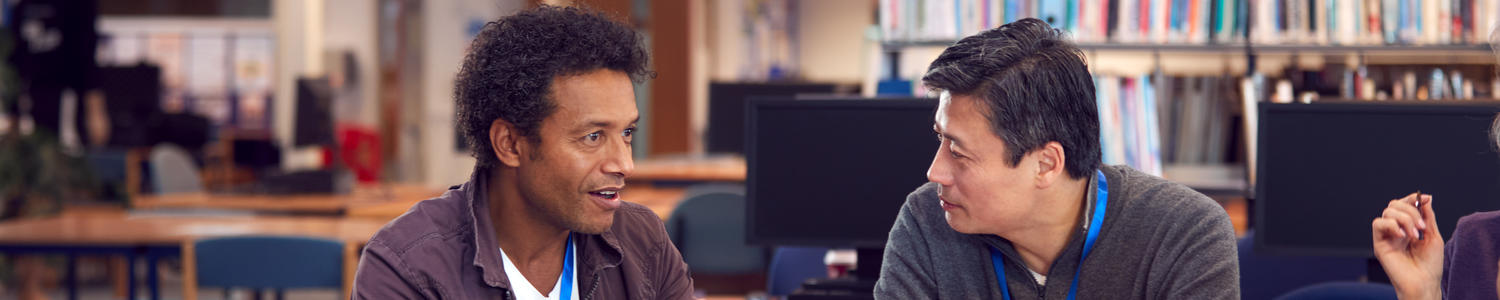 Two people discussing research.