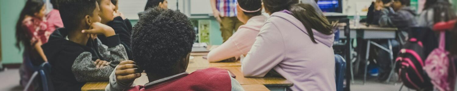 Teacher teaching students in classroom