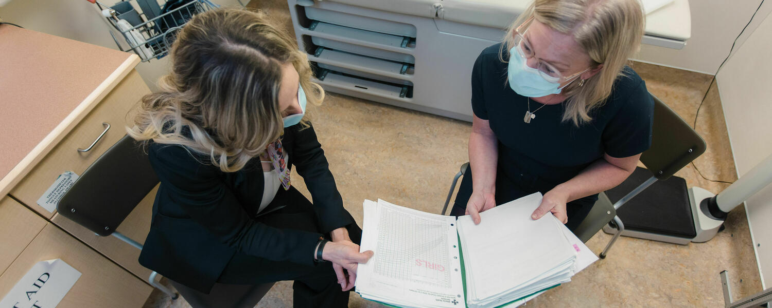 Two subspecialists discussing file