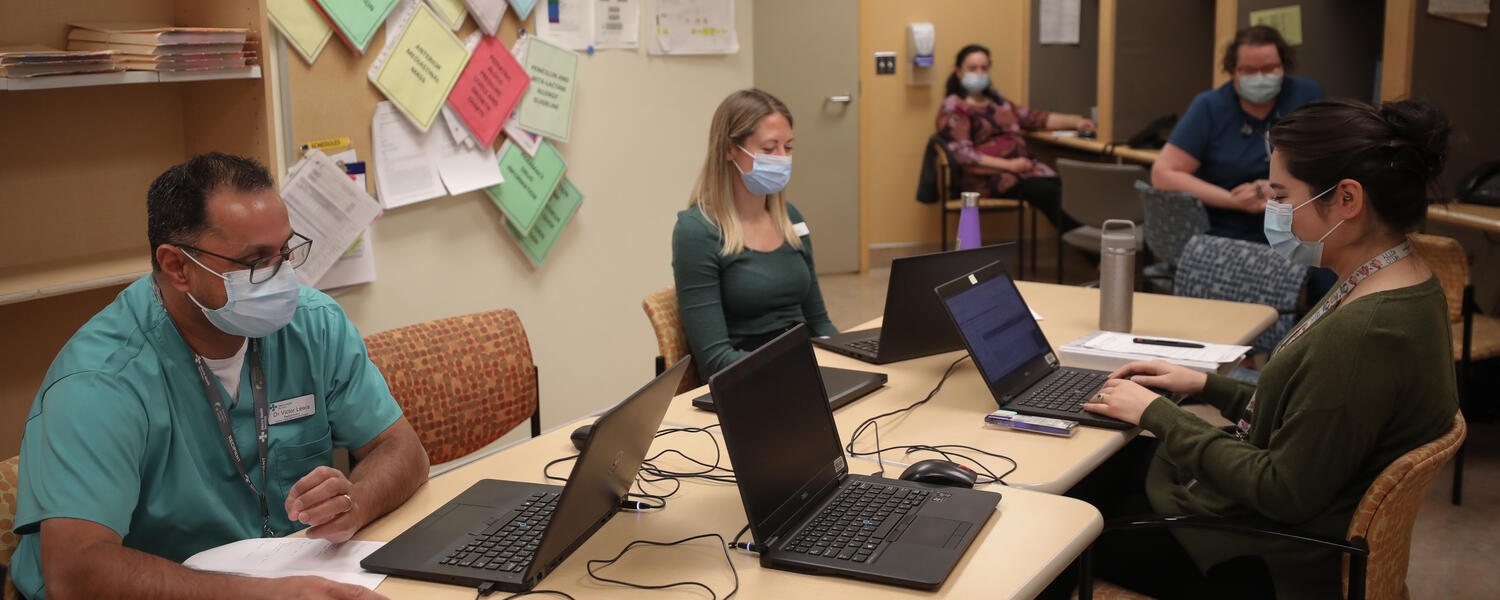 Healthcare workers working on computers