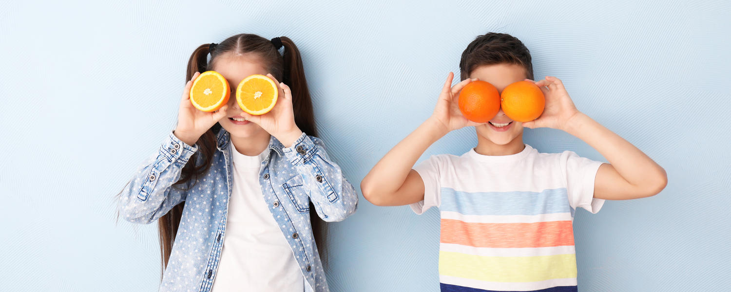 Children playing with fruit