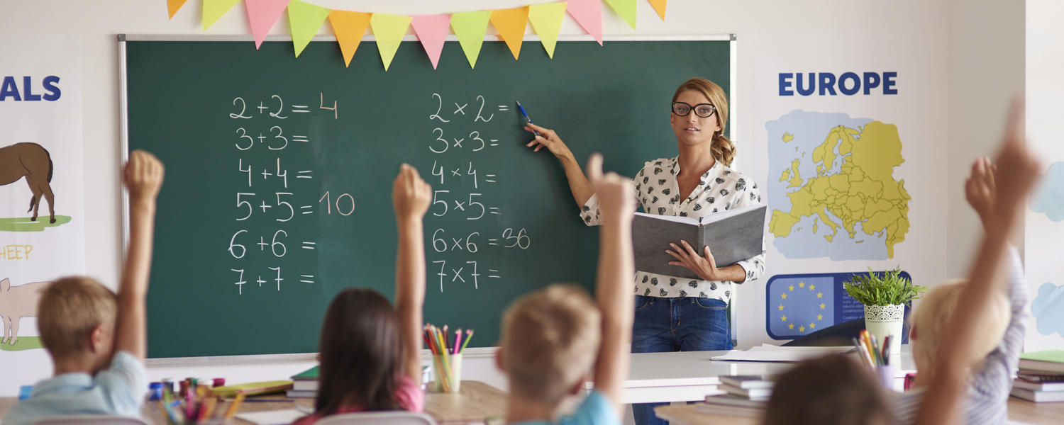 Teacher in classroom with children