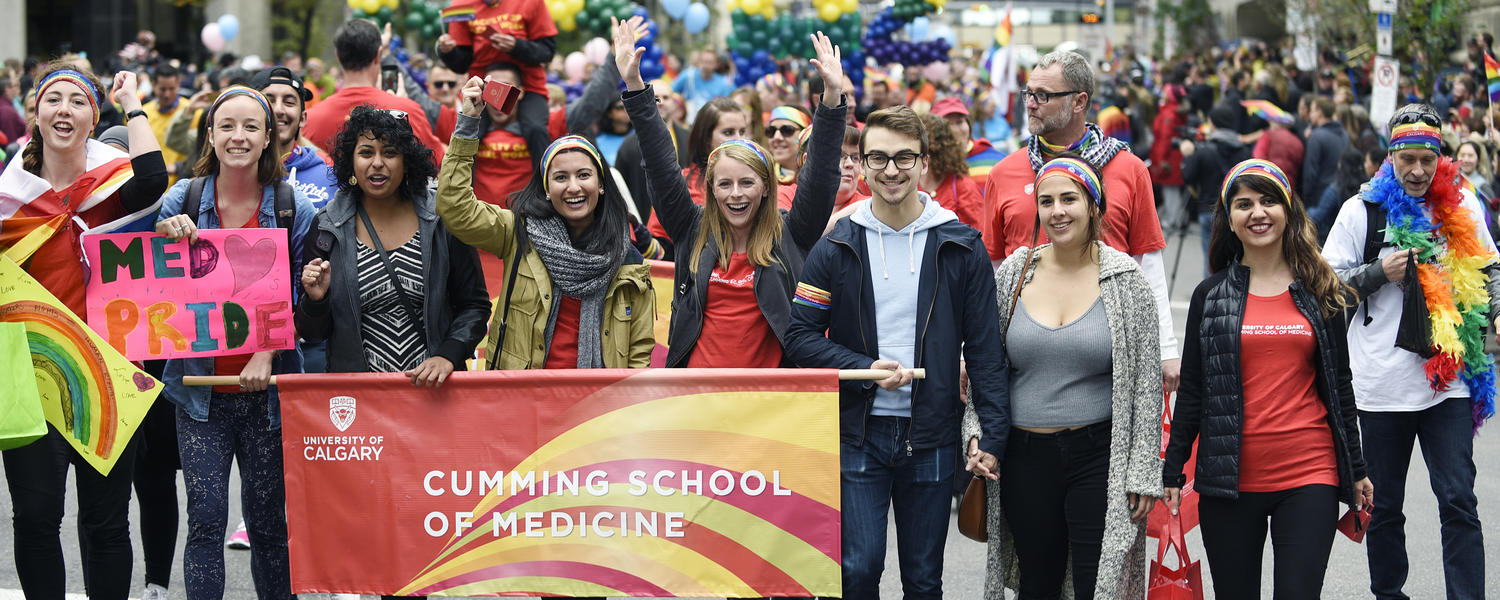 Group of diverse students walking in a pride parade
