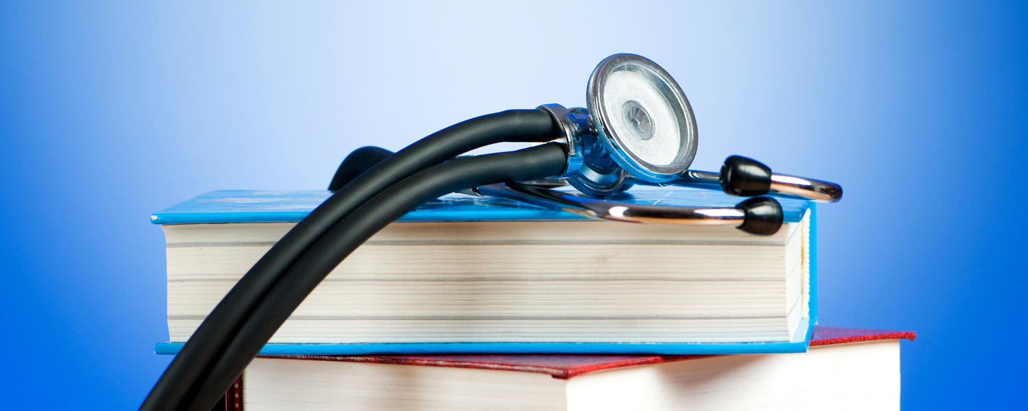 Stethoscope and textbooks