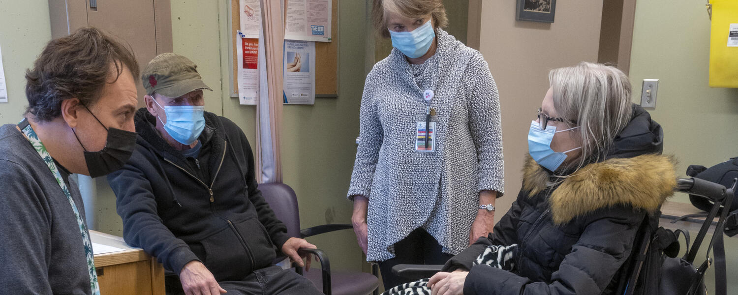 Neurologist Dr. Davide Martino visits with a patient at Foothills Medical Centre