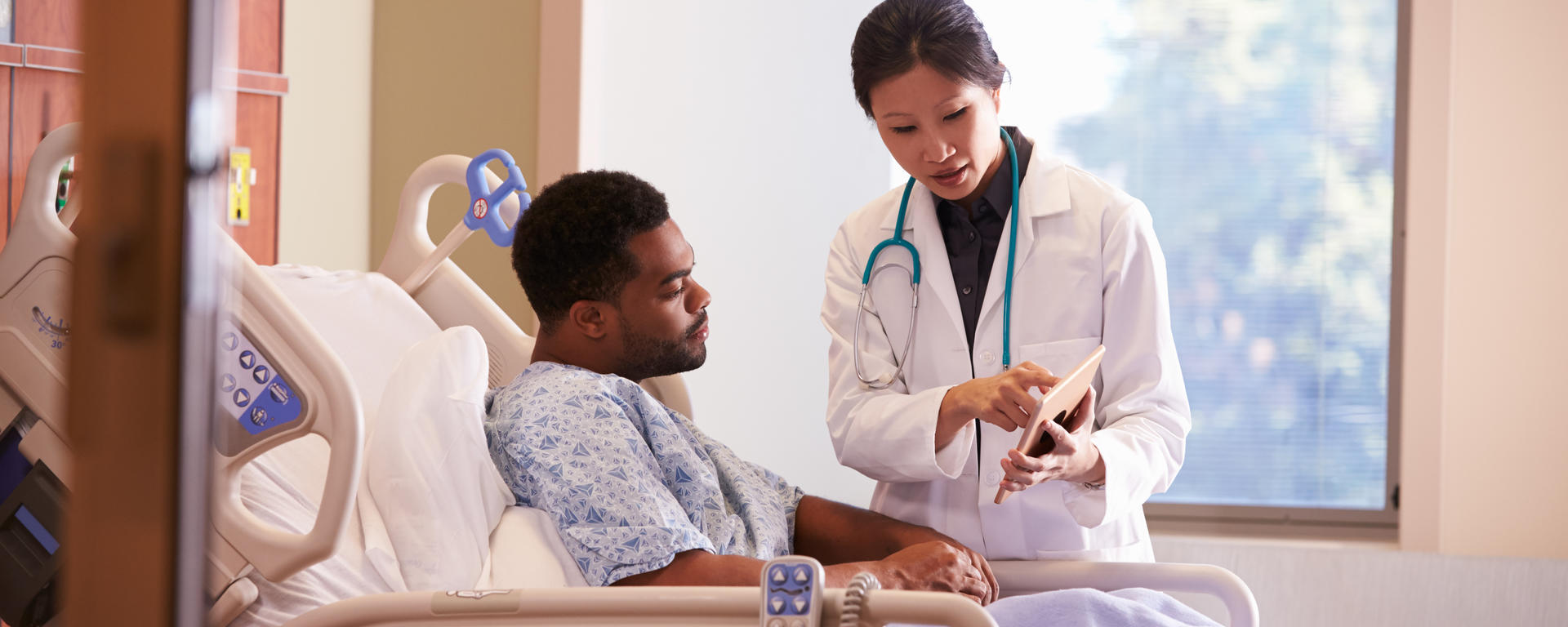 patient and doctor reviewing an Ipad