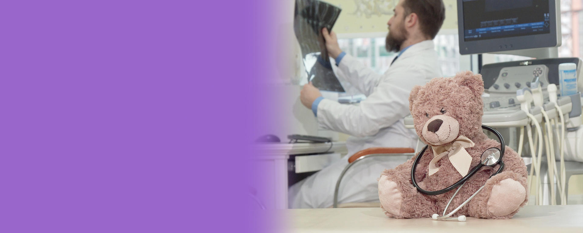 Doctor holding x-ray with teddy bear