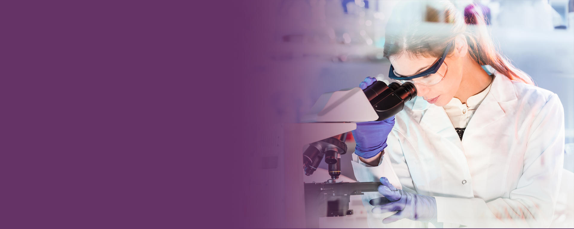woman looking at a microscope