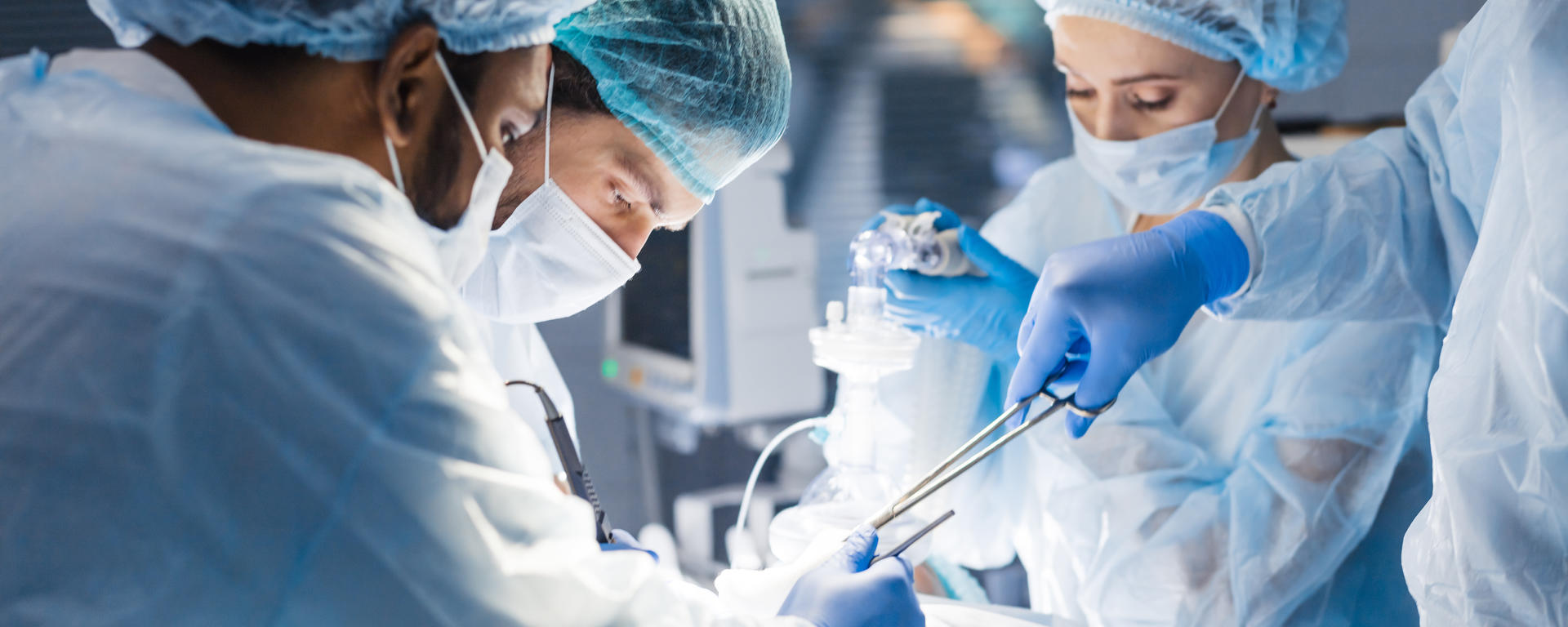 Group of surgeons operating