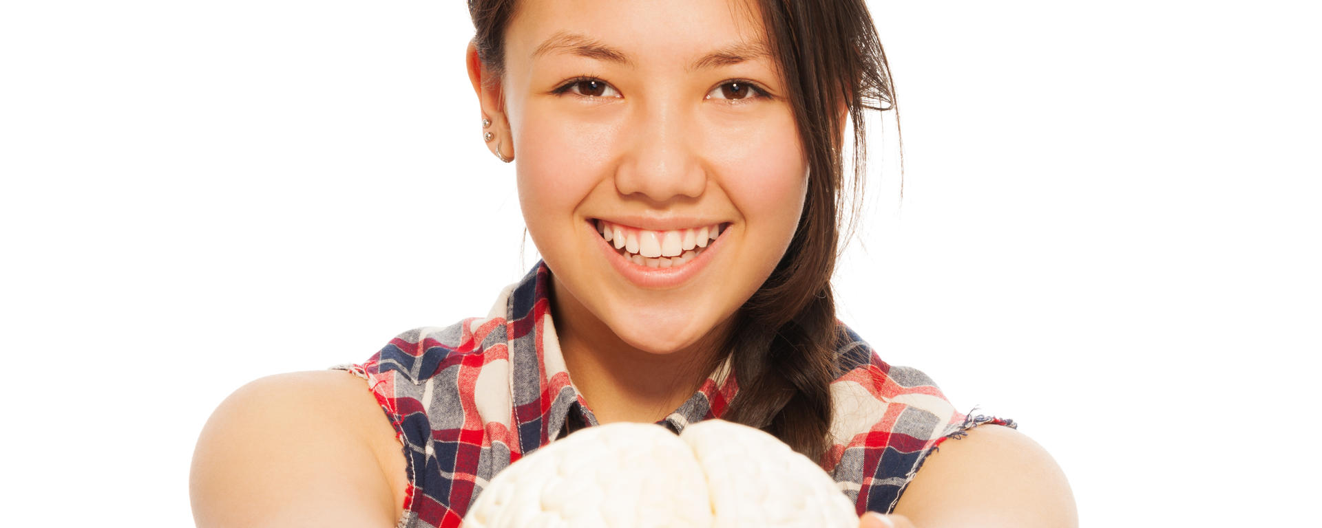 girl holding toy brain