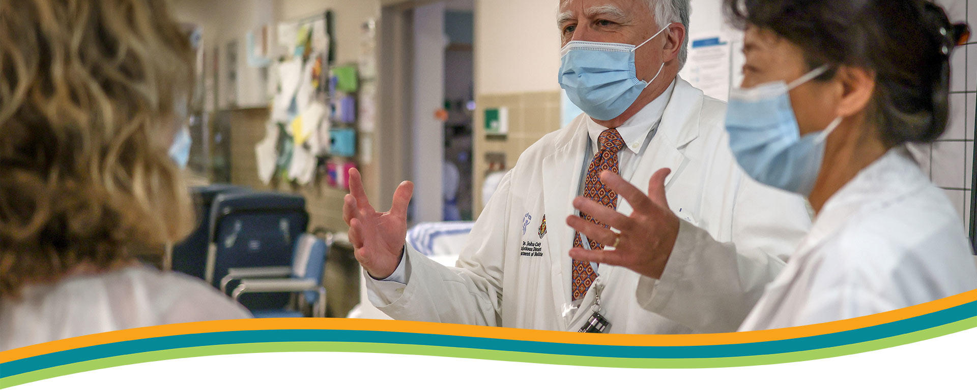 Department of Medicine About Us Banner - Physicians having a discussion