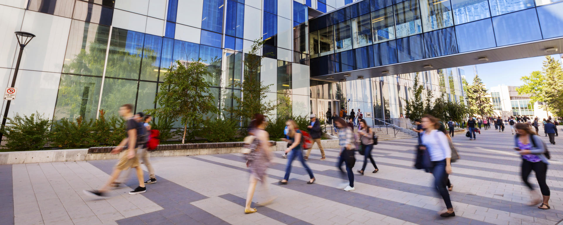 A timelapse photo of people walking on a summer day on Main Campus at the U of C