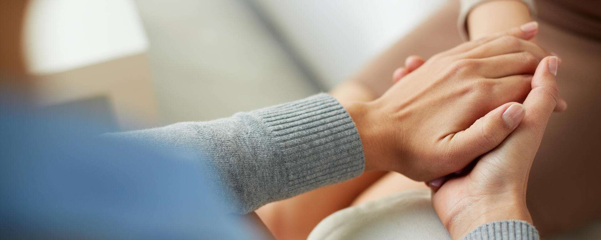 view is over the left hand shoulder of a person holding the person across from thems hand
