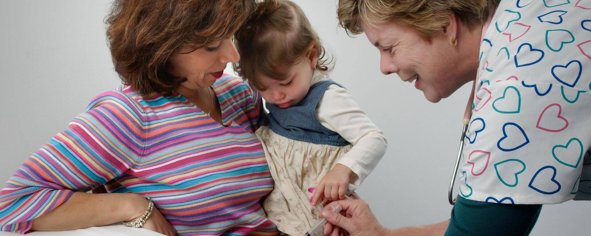 mom and child with healthcare provider