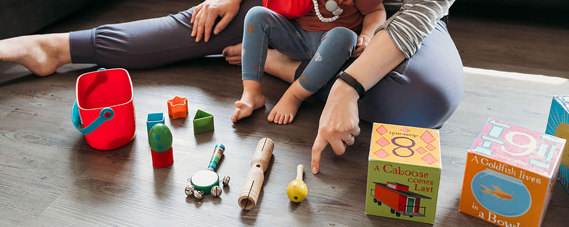 child with lots of toys