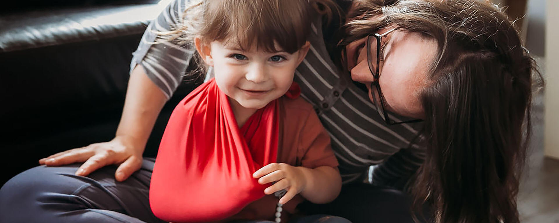 child smiling on parent lap