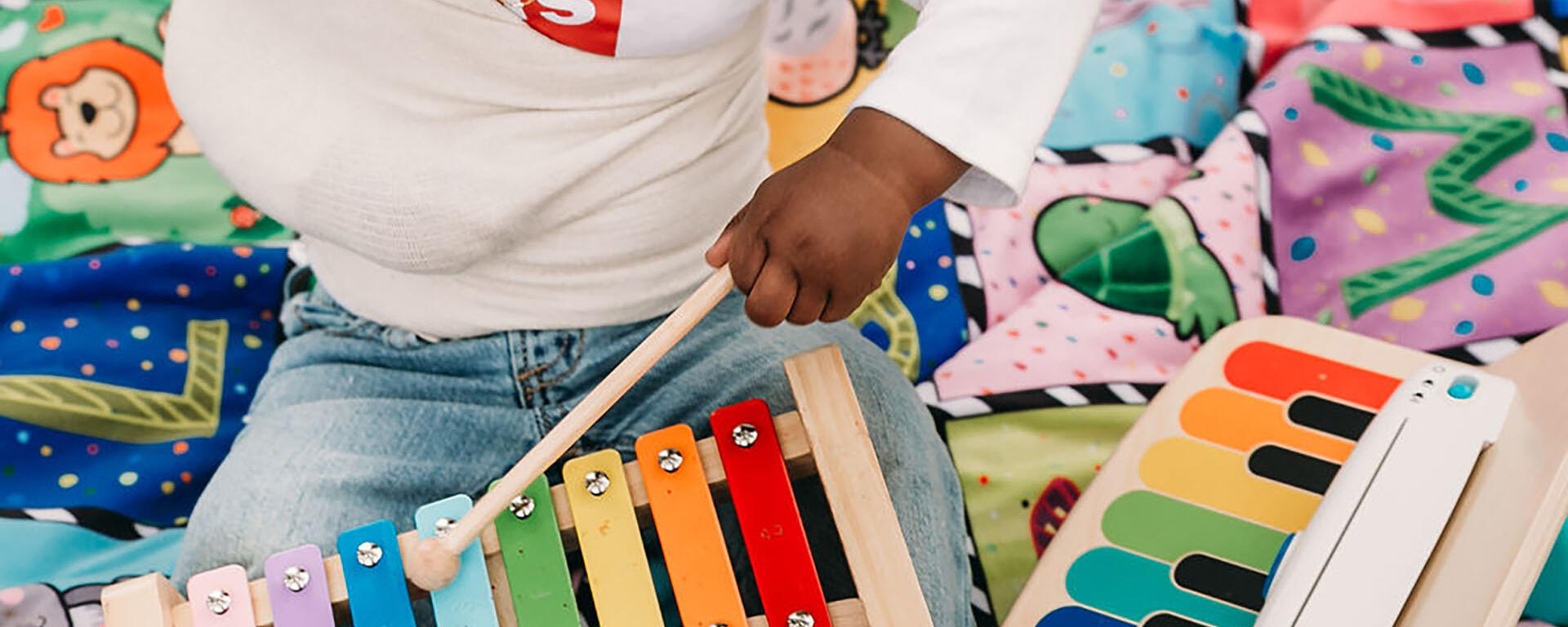 child playing xylophone