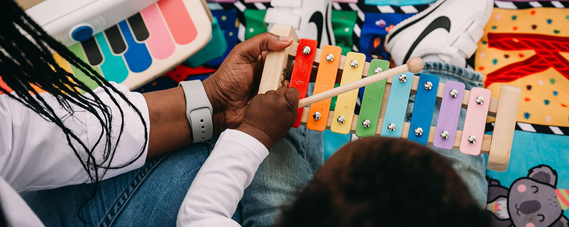 hand holding xylophone for child